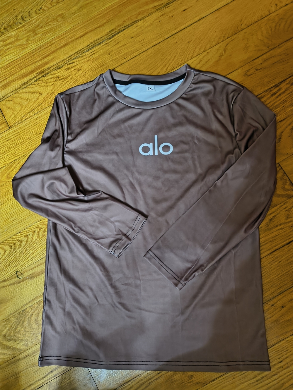 Alo Women's Long-Sleeve Performance Shirt in Brown